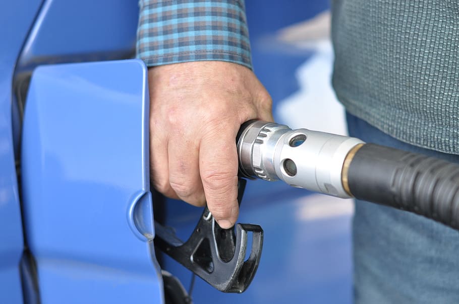person, holding, gasoline nozzle, gas station, fuel, refueling, oil, human hand, hand, men