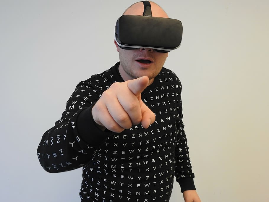 person, wearing, black, crew-neck, long-sleeved, shirt, using, virtual, reality headset, virtual reality