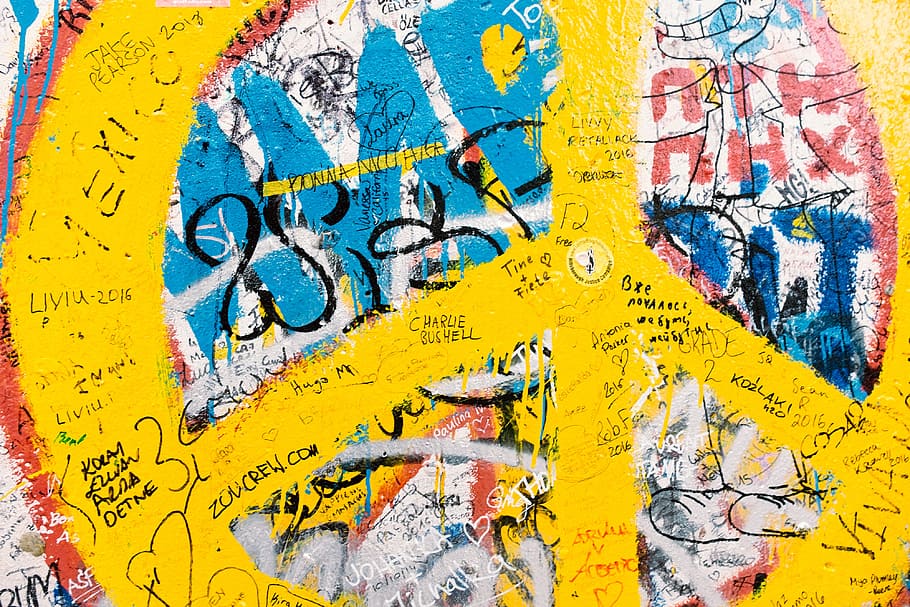 Graffiti, Berlin Wall, arts and Entertainment, yellow, travel destinations, politics, city, close-up, communication, text