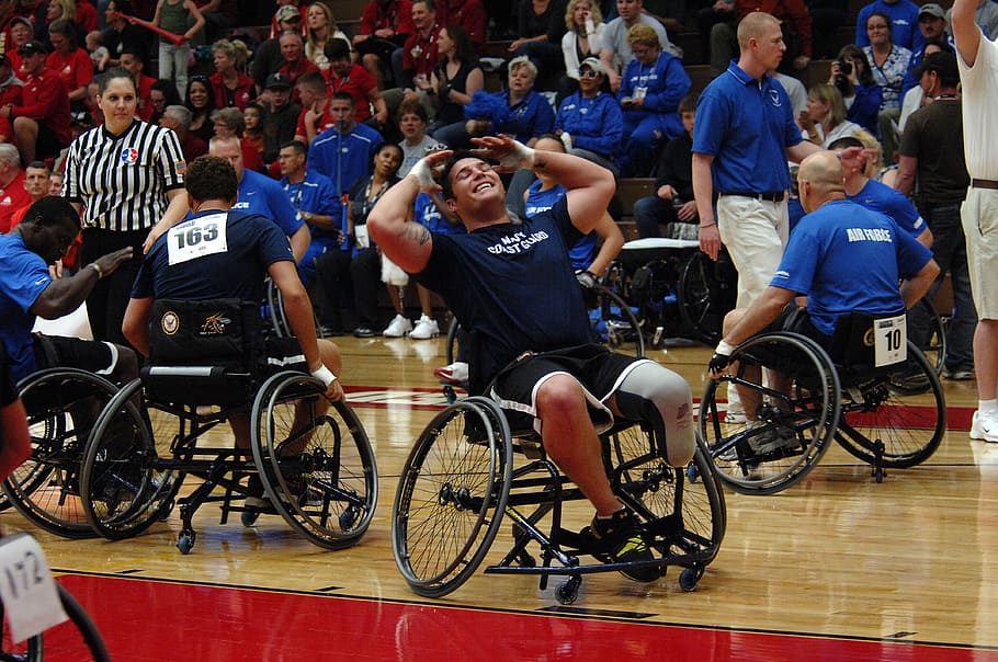 people playing basketball, wheelchairs, basketball, sports, court, fans, spectators, players, injured, disability