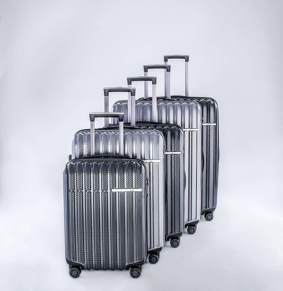 luggage, travel case, metallic lugguage, silver colored, white background, business, studio shot, indoors, day, metal