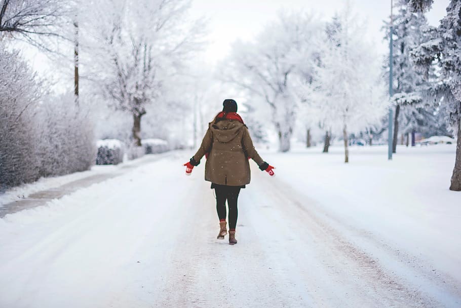 woman, walking, snow-covered, road, daytime, street, tree, plant, nature, outdoor