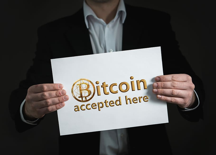 man, holding, bitcoin, accepted, signage, crypto-currency, currency, money, cash and cash equivalents, buy