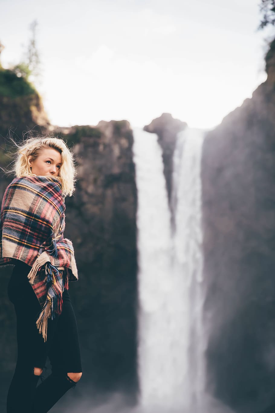 woman, holding, brown, red, blue, plaid, scarf, facing, waterfalls, waterfall
