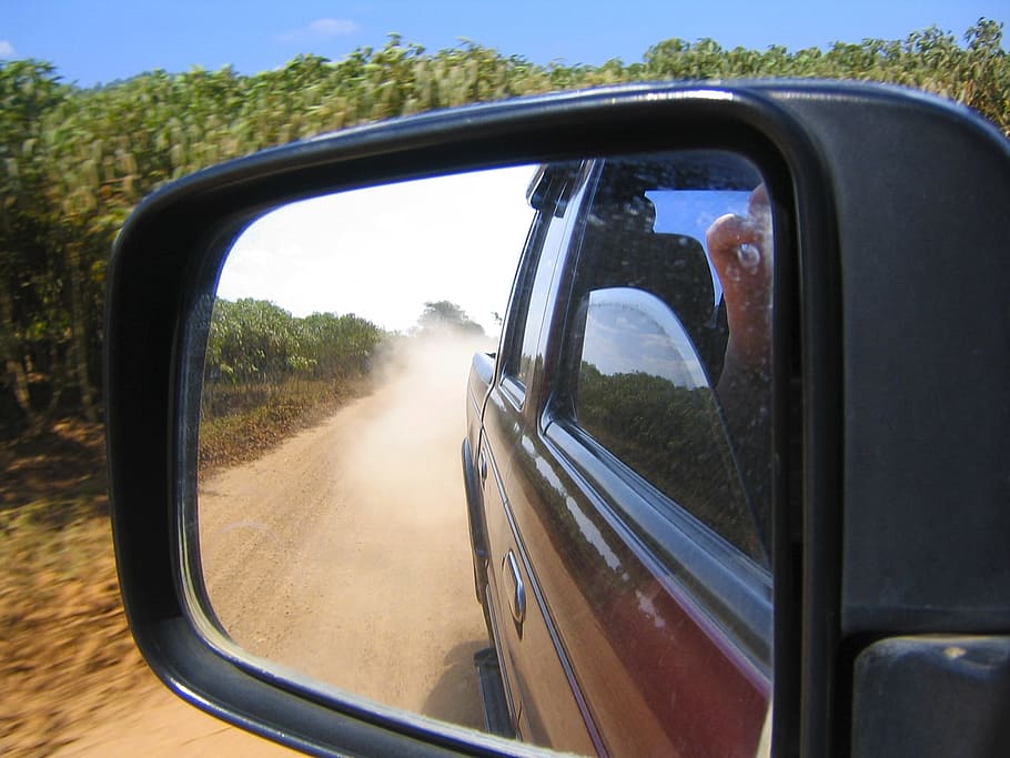 unpaired, black, vehicle side mirror, offroad, look in side mirrors, dust, mode of transportation, reflection, side-view mirror, land vehicle