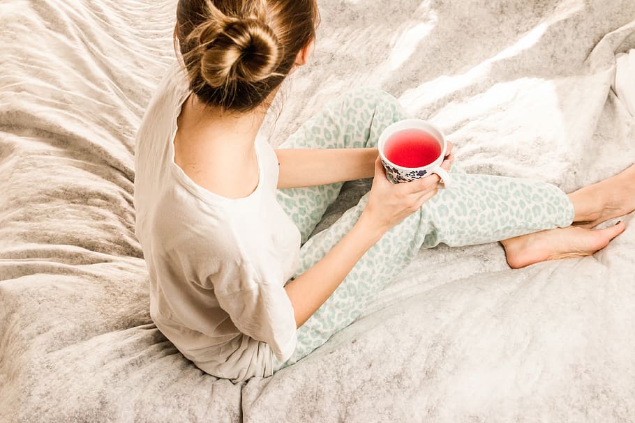 woman, bed, drink, tea, food, pyjamas, red, pop, juice, feet