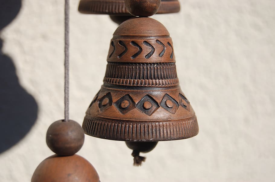 campanella, rattles, bells in the wind, close-up, indoors, brown, day, high angle view, focus on foreground, wood - material