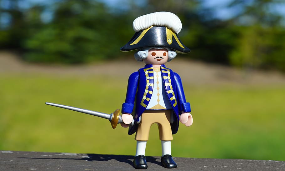 selective, focus photography, royal, soldier, holding, sword action figure, general, toy, history, united states