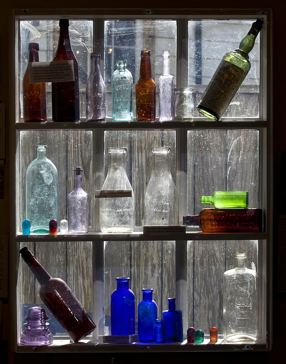 old bottles, display, colored glass, glass, old, vintage, wood, shelf, bottles, drink
