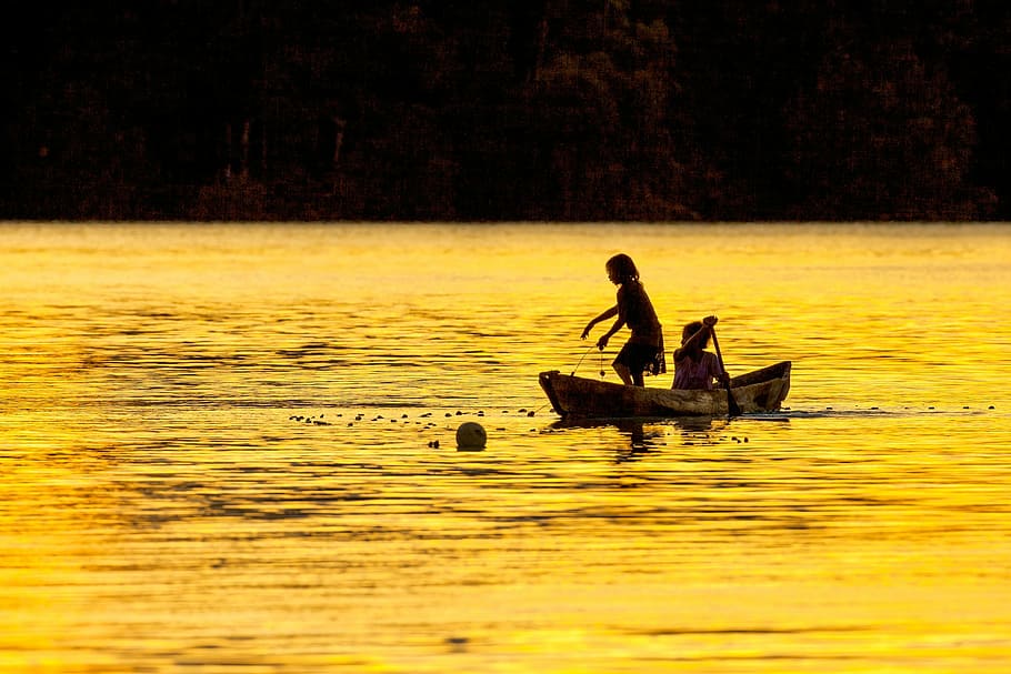 two, people, boat, body, water, sister, evening, fish caught, dugout canoe, lagoon silhouette