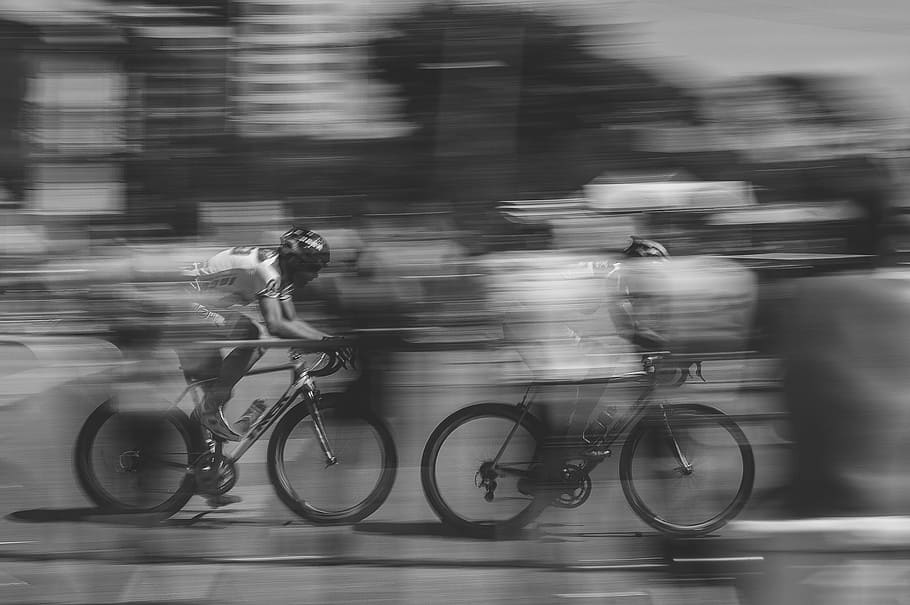 two, person, racing, bicycle grayscale photo, bike riding, fast moving, bike, motion, cycle, bicycle