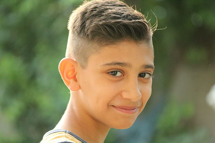 boy, portrait, hair, outdoor, childhood, smile, iraq, headshot, one person, looking at camera
