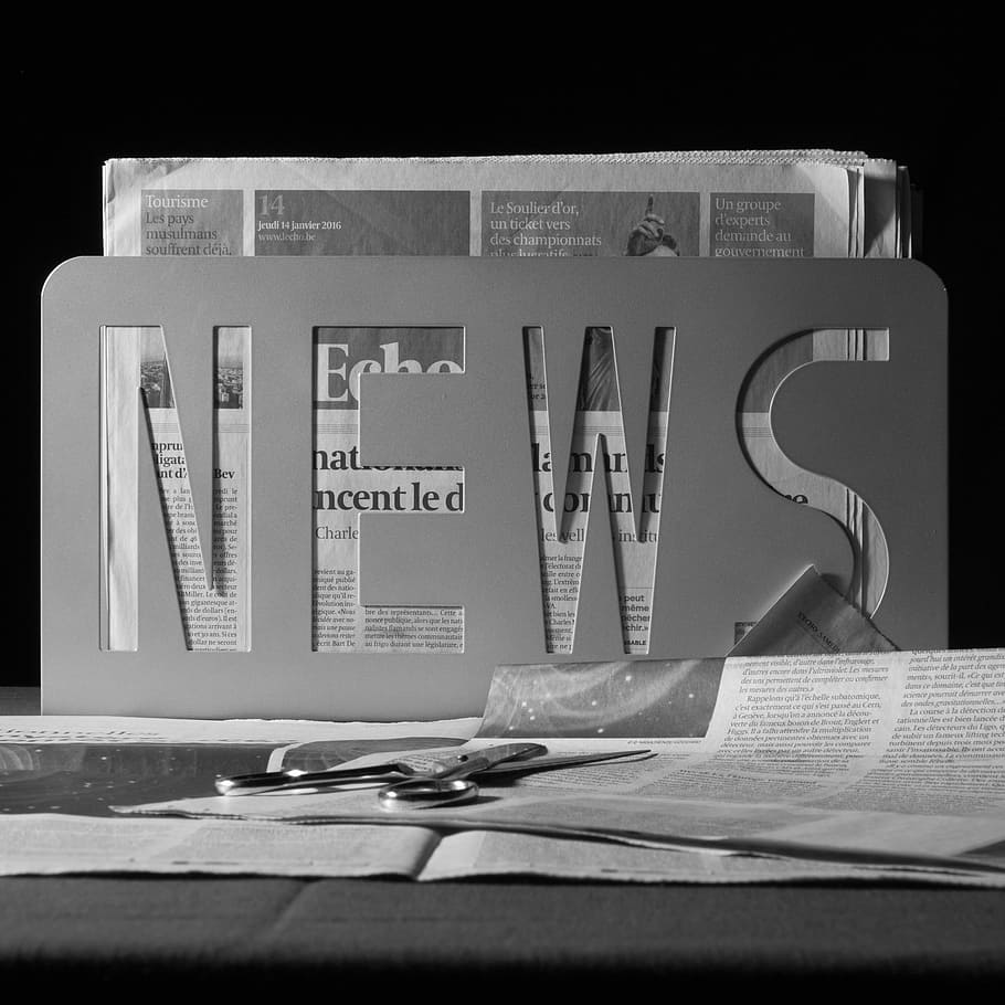 newspaper article, paper, news, journal, newspapers, black and white, text, indoors, table, western script