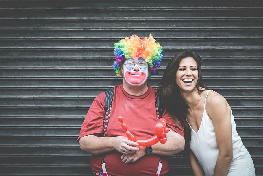 woman, clown photo, people, friends, couple, smiles, happy, clown, balloons, man