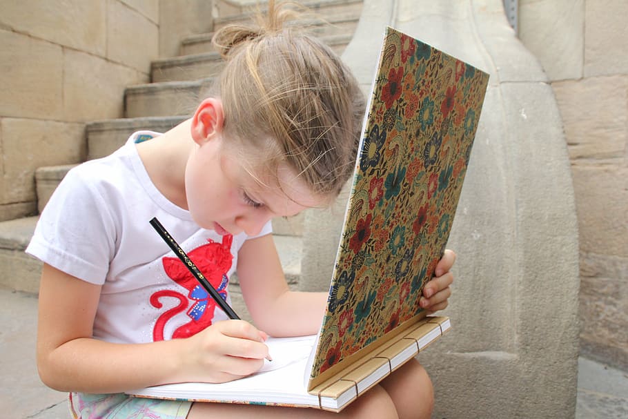 girl, wearing, white, t-shirt, writing, drawing, draw, ladder, pencil, stone