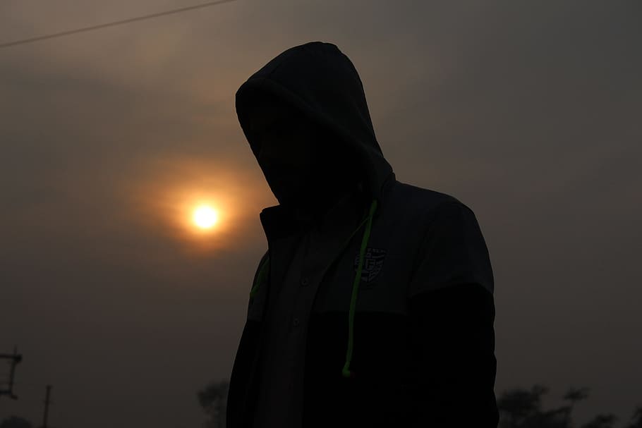 sunset, silhouette, people, backlit, sun, one person, hood, sky, waist up, real people