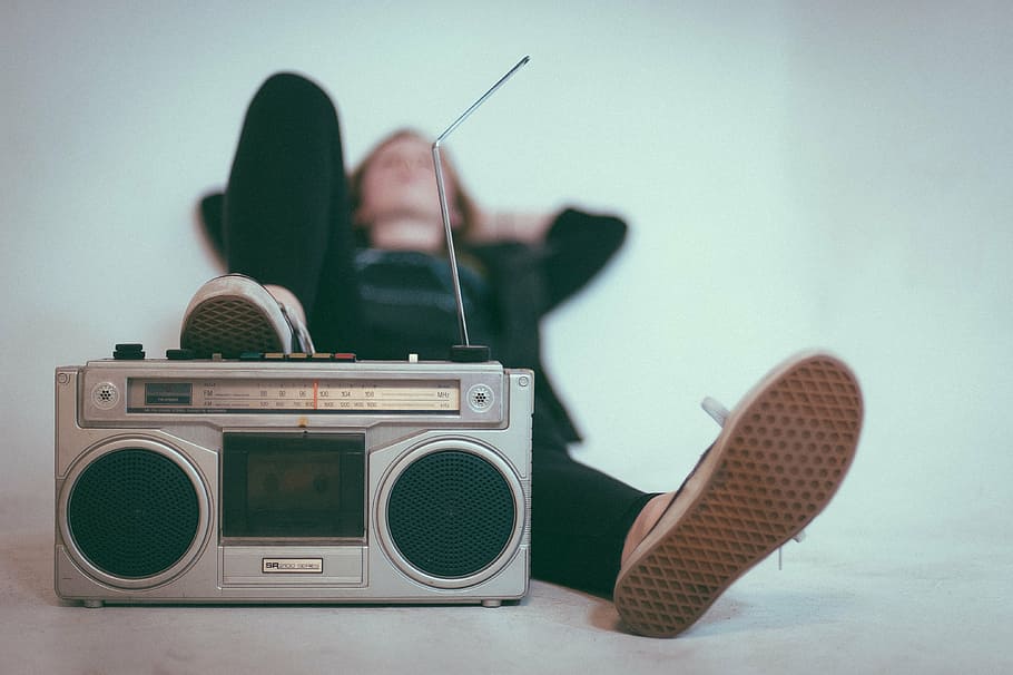 person, leaning, white, wall, gray, boombox, radio, channel, medium, speakers