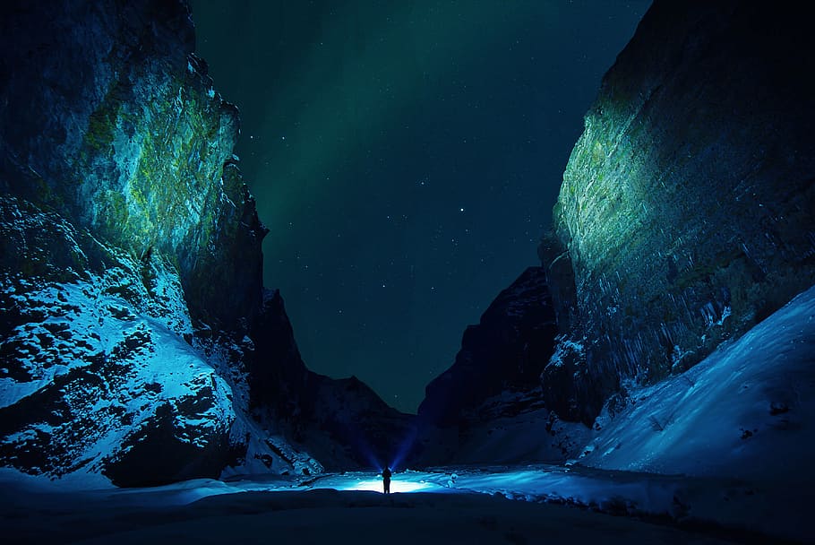 silhouette, person, standing, mountain, ice, cave, rocks, snow, winter, flashlights