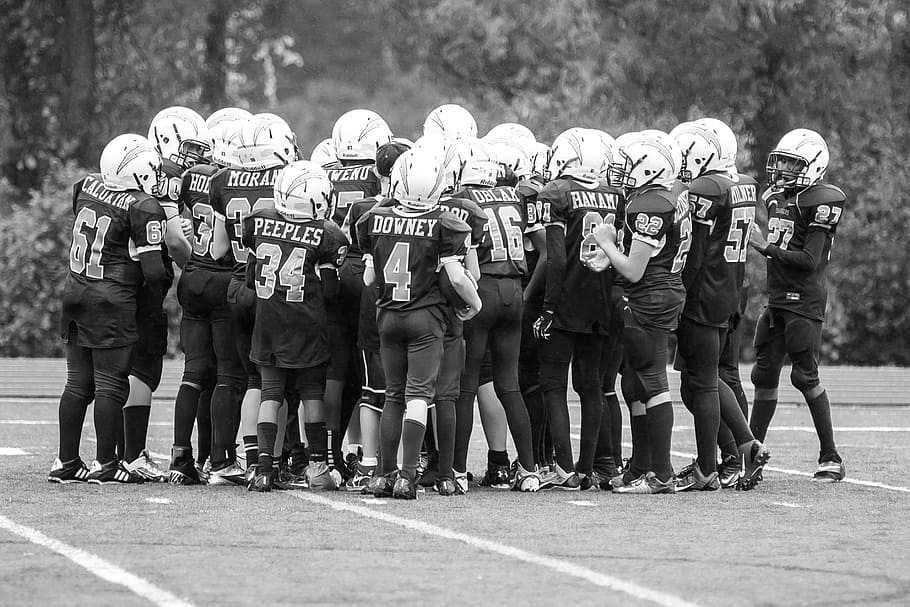 grayscale photo, football team, football, sports, youth sports, michigan sports, men, crowd, real people, large group of people