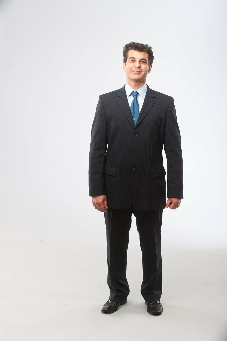 man, wearing, black, suit jacket, dress pants, standing, inside, white, room, boss