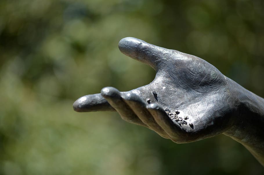 statue, hand, sculpture, birdseed, bronze, close-up, focus on foreground, day, art and craft, representation
