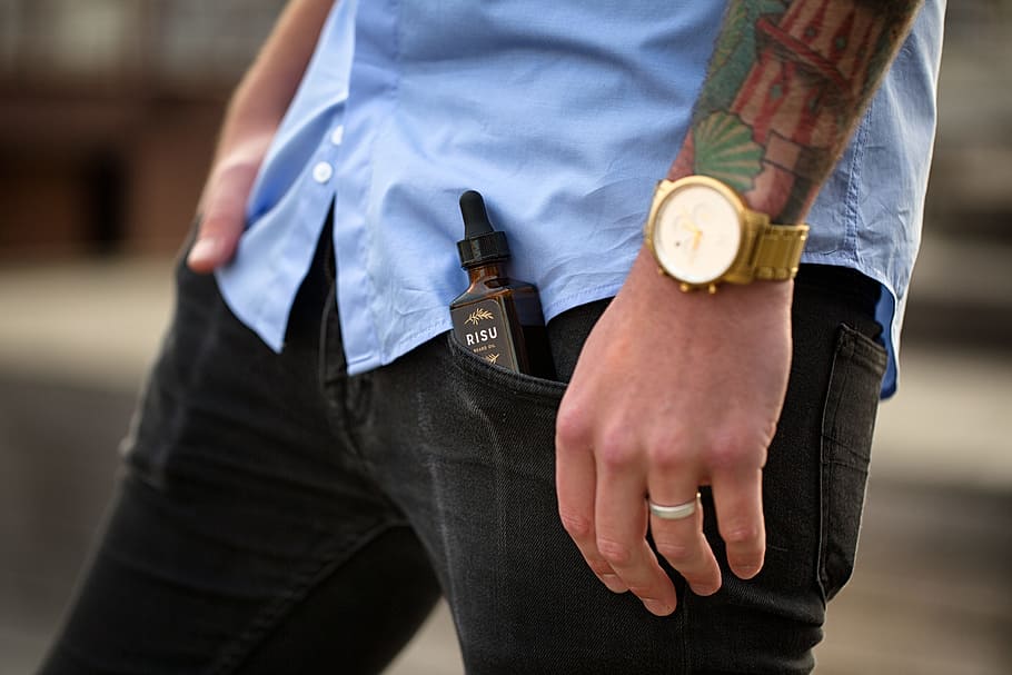 man, wearing, black, bottoms, e-juice bottle, left, pocket, tattoo, fashion, style