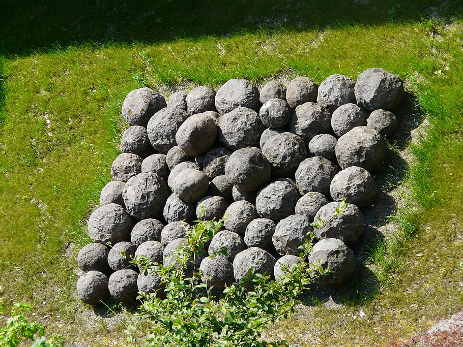cannon balls, balls, stone balls, middle ages, grass, plant, day, growth, field, nature