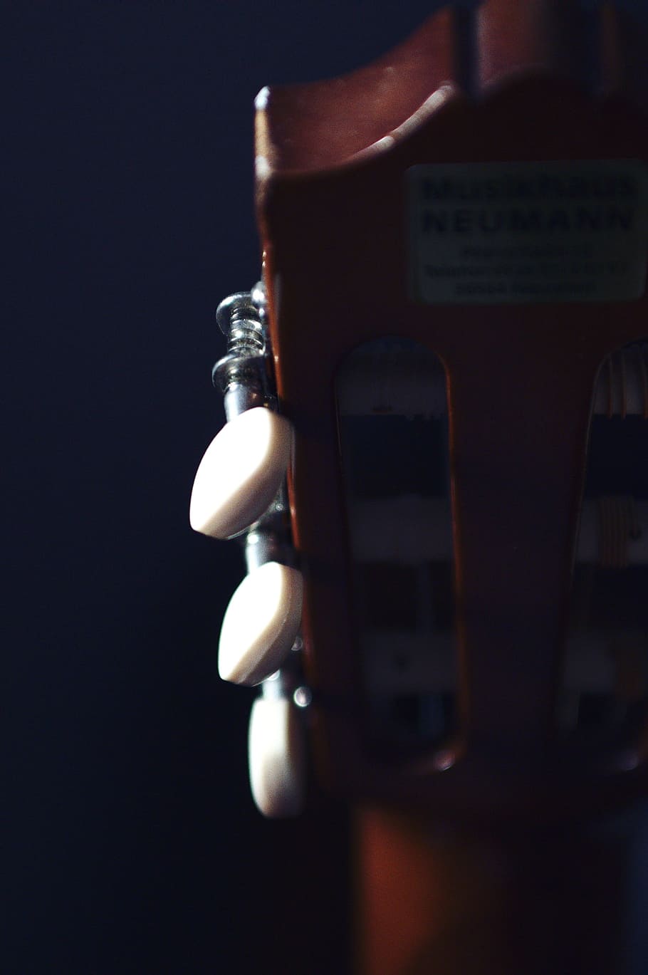 headstock, acoustic, guitar, tuners, musical, studio shot, close-up, black background, indoors, communication