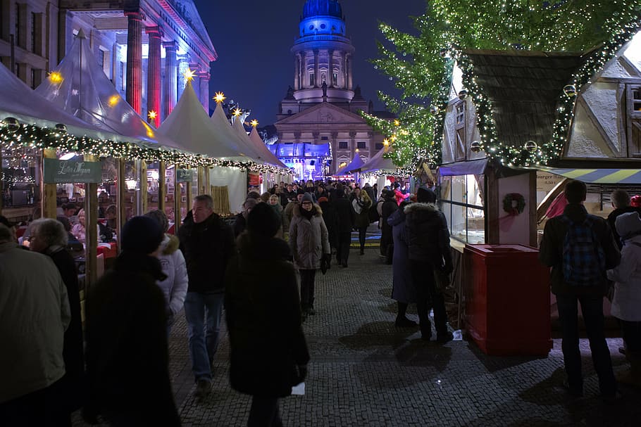 group, people, standing, buildings, nighttime, berlin, christmas market, visitors, stalls lights, cold weather