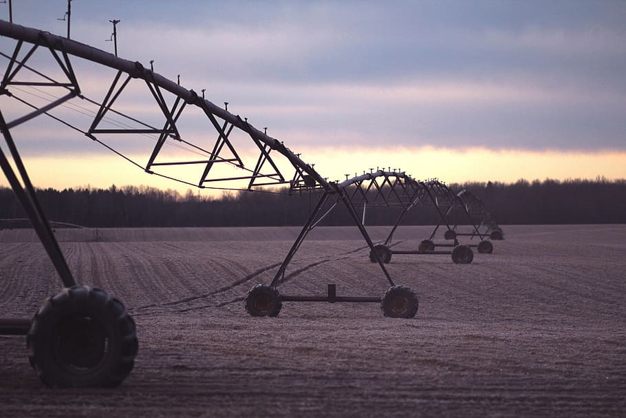 black, metal, wheeled, conveyor, open, field, irrigation, agriculture, equipment, nature