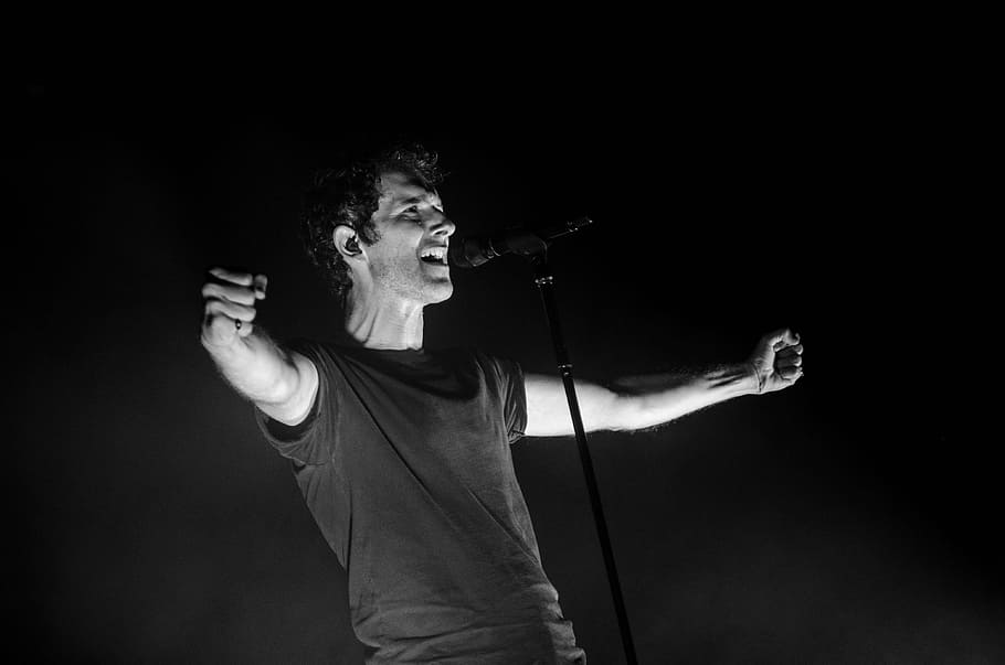 grayscale photo, man, singing, adult, concert, dark, entertainer, hands, microphone, microphone stand