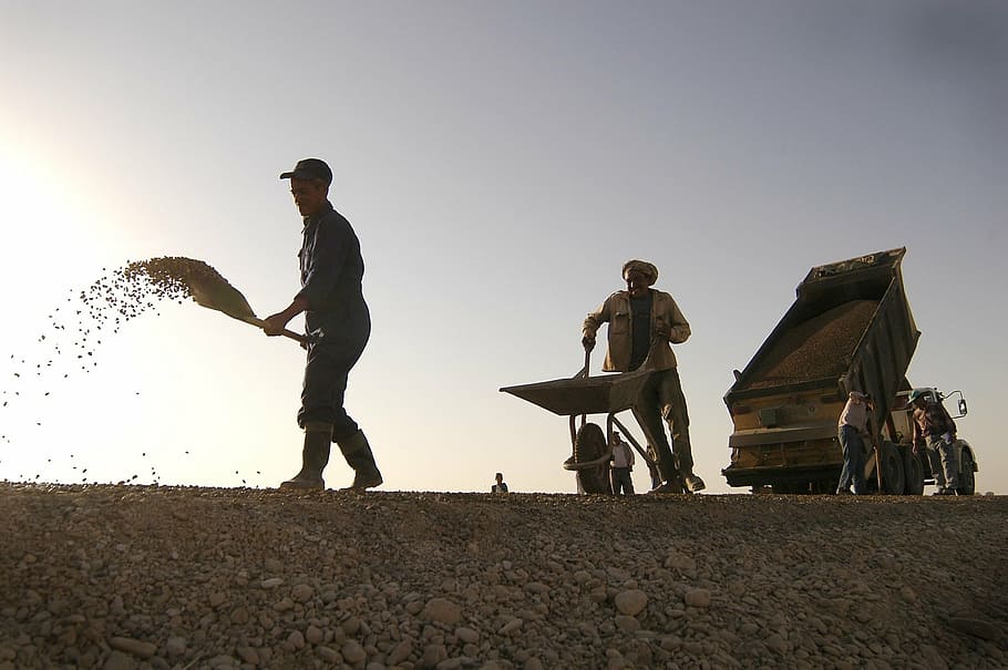 man pushing wheelbarrow, construction, workers, shovel, wheelbarrow, dump truck, road, site, building, labor