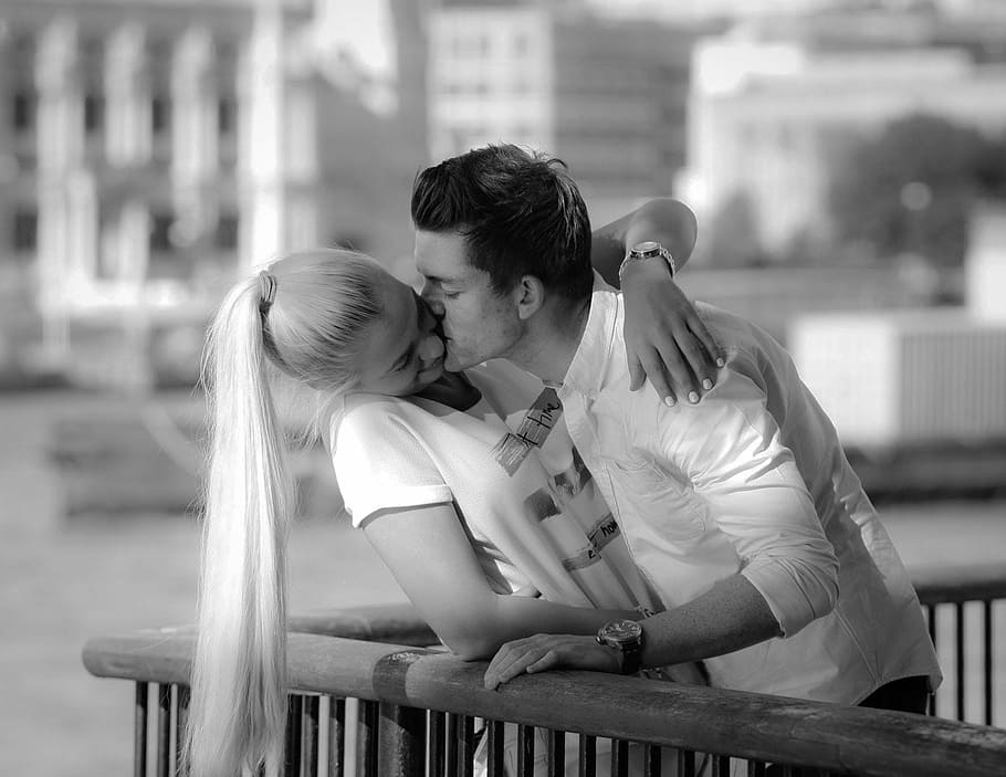 grayscale photography, man, kissing, woman, cheek, grayscale, photography, people, couple, kiss