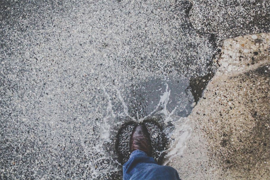 puddle, splash, leather, shoe, jeans, wet, rain, water, one person, motion