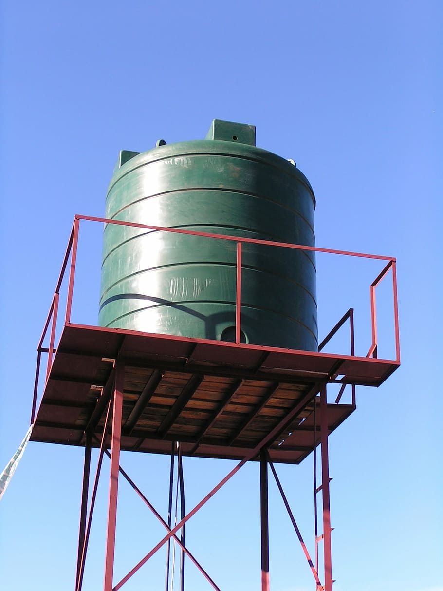 water tank, water tower, water, sanitary, sky, low angle view, storage tank, clear sky, factory, blue