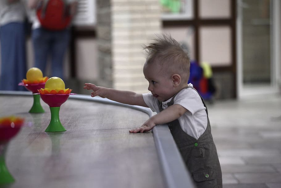 kid, reaching, plastic toys, brown, table, selective, focus photo, Magic, Attraction, baby