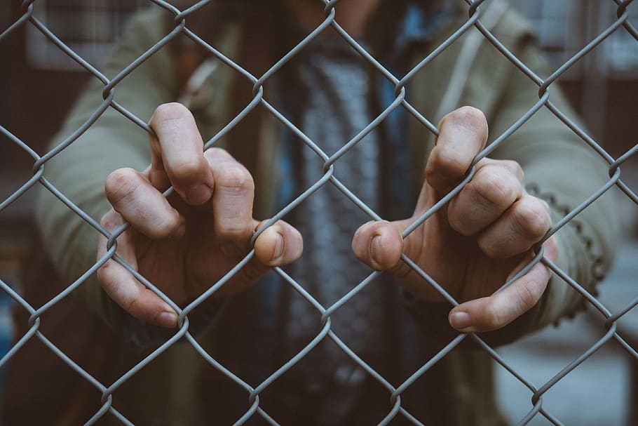 people, hand, fence, human hand, human body part, chainlink fence, safety, prisoner, prison, protection