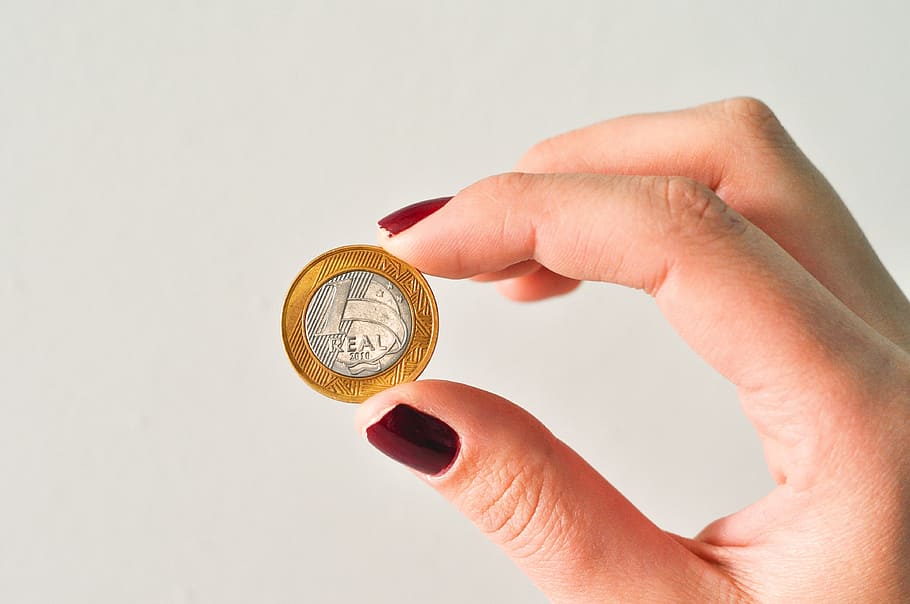 person, holding, round silver-and-gold-colored coin, Money, Currency, Finance, real, brazilian currency, income, salary