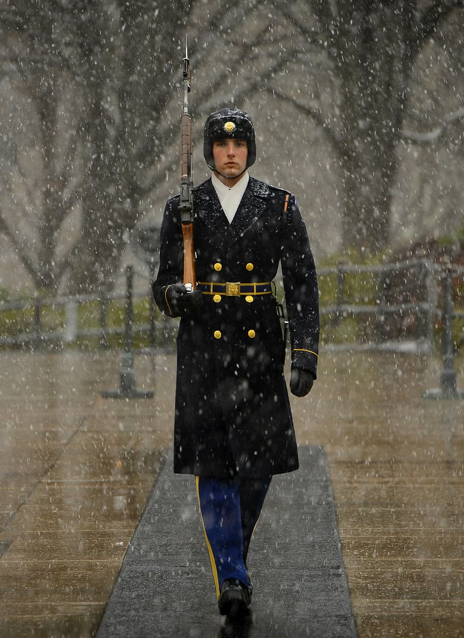 man, wearing, black, coat, holding, brown, rifle, sentinel, tomb of unknown soldier, guard