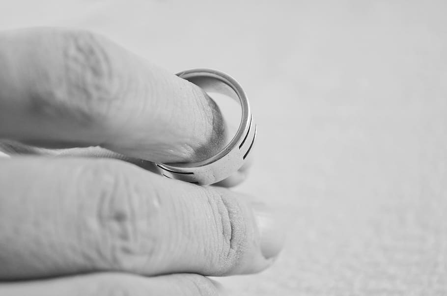 person, holding, silver-colored ring, hand, finger, people, ring, marriage, divorce, decisions