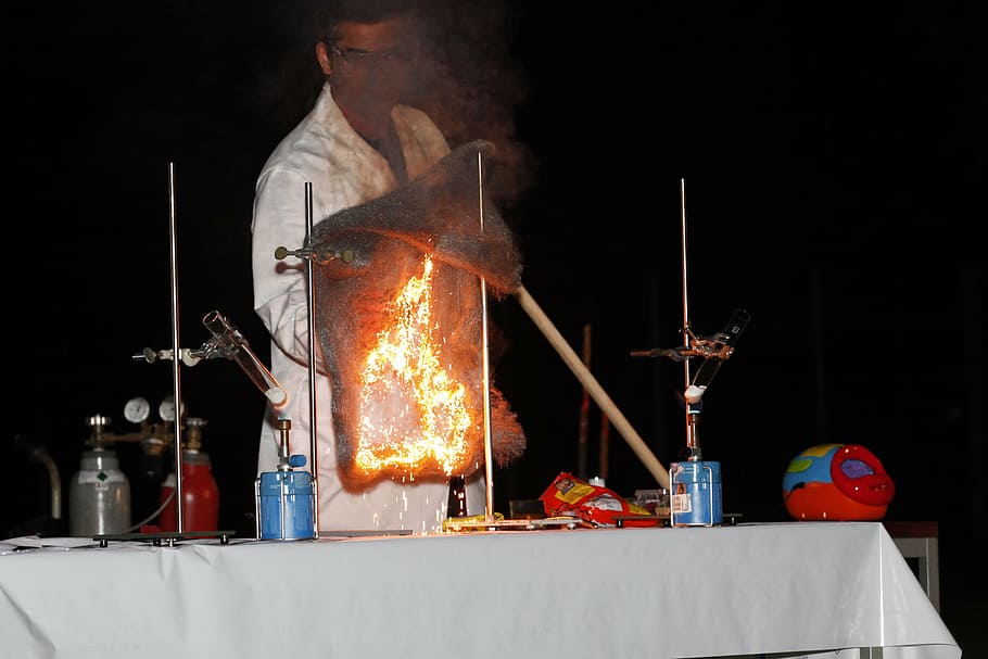 chemistry show, steel wool, oxidation, one person, heat - temperature, occupation, metal, protection, men, smoke - physical structure
