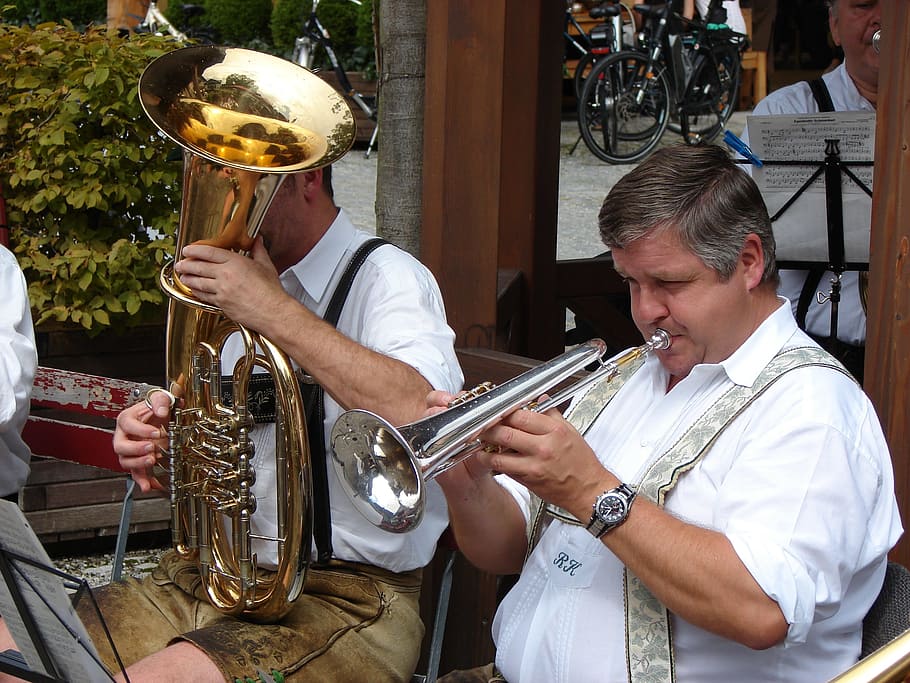 man using trumpet, trumpet, village festival, customs, men, leather pants, brass band, music, tuba, costume