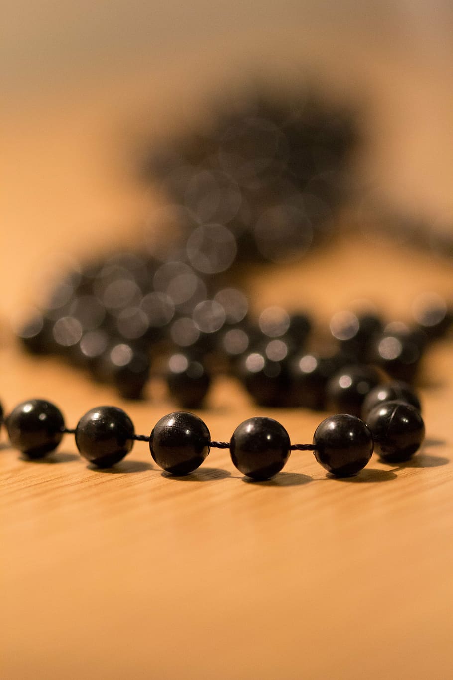 beads, pearl, necklace, black, plastic beads, fuzzy, choker, close-up, selective focus, table
