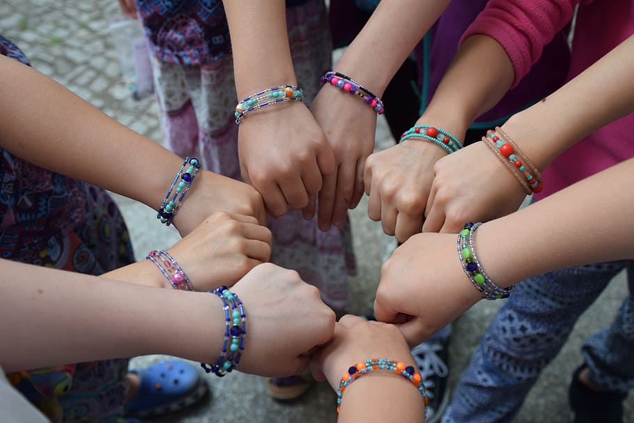 person fish, birthday, beads, children, hand, human body part, human hand, bracelet, group of people, togetherness
