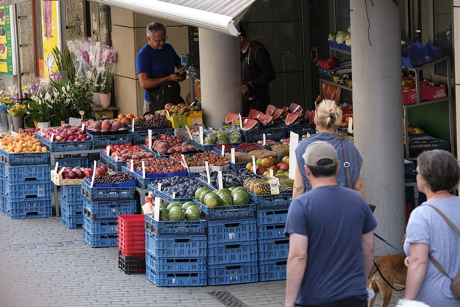 several, people, standing, front, variety, fruits, blue, crates, vegetables, vegetable market