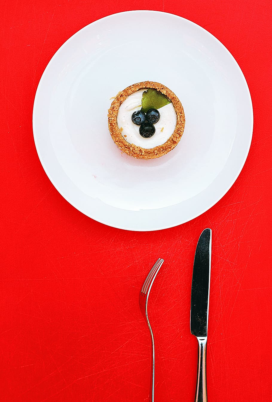 blackberry cake, white, ceramic, plate, round, near, stainless, steel, knife, fork