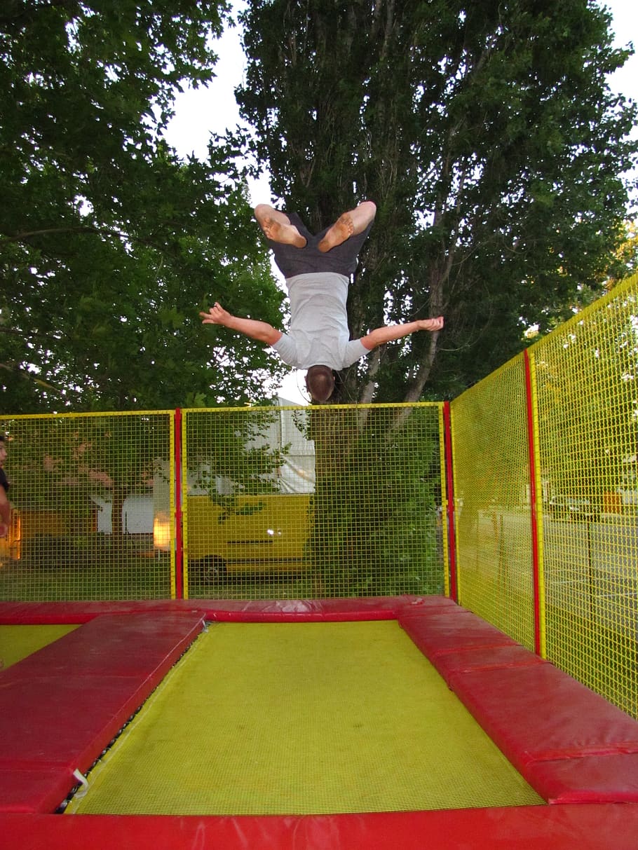 sports, trampoline, bounce man, go to, somersault, entertainment, mid-air, plant, one person, jumping