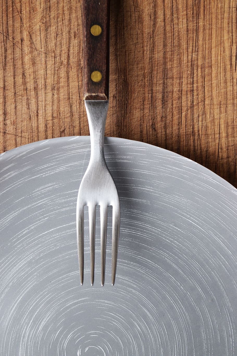 stainless, steel fork, brown, handle, fork, plate, dish, menu design, cutting board, wooden