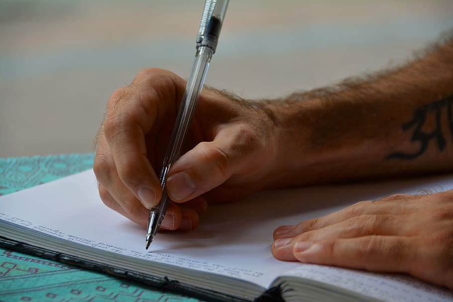 pessoa, segurando, caneta, branco, página do livro, mãos, escrevendo, diário, jornal, papel