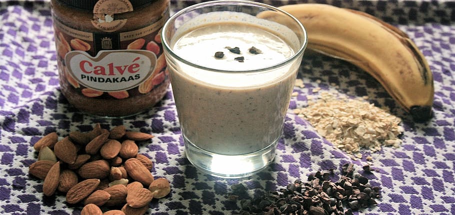 almond nuts, glass, breakfast drink, almond, cocoa, nibs, shake, banana, peanut butter, smoothie